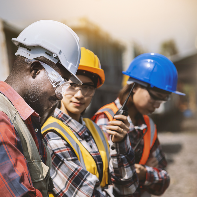 Construction workers wearing hard hats